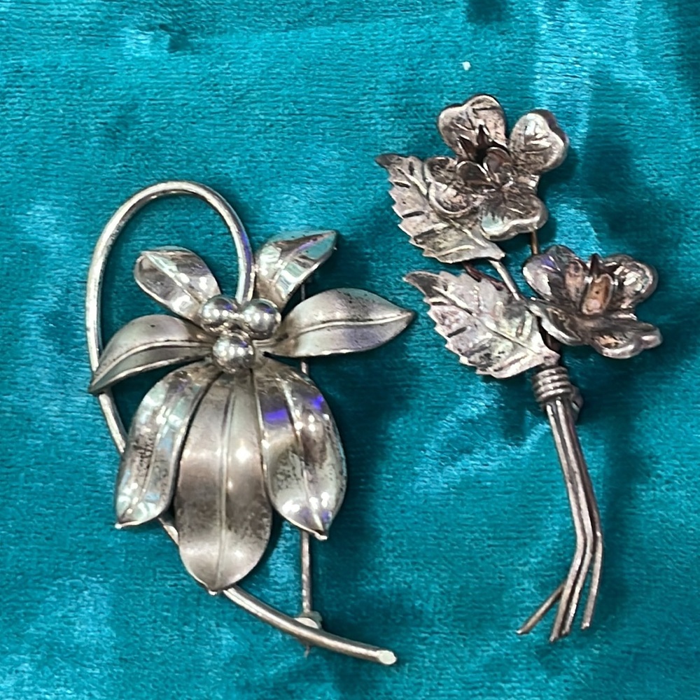 Two vintage sterling pins, florals